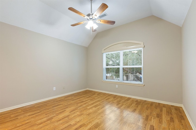 unfurnished room featuring lofted ceiling, ceiling fan, light wood-type flooring, and baseboards