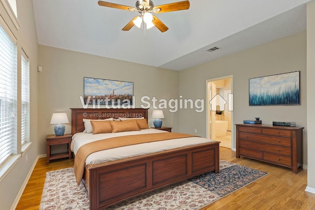 bedroom with ensuite bathroom, a ceiling fan, baseboards, visible vents, and light wood-style floors