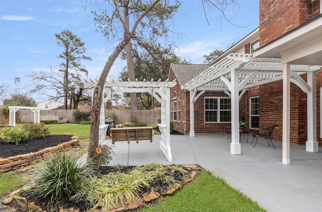 view of patio with a fenced backyard and a pergola