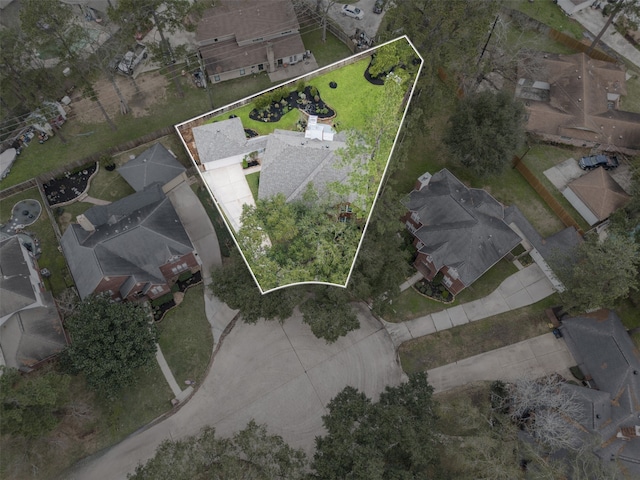 birds eye view of property with a residential view