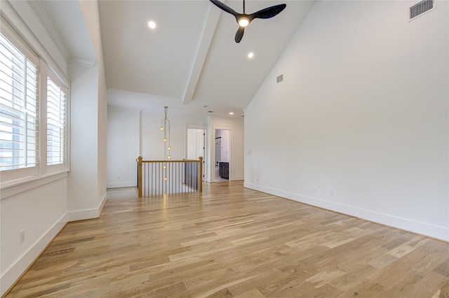 unfurnished room with recessed lighting, visible vents, baseboards, light wood-style floors, and beam ceiling