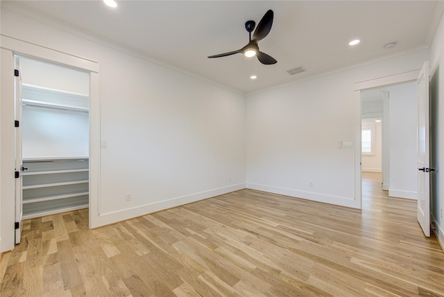 unfurnished bedroom featuring recessed lighting, baseboards, crown molding, and light wood finished floors