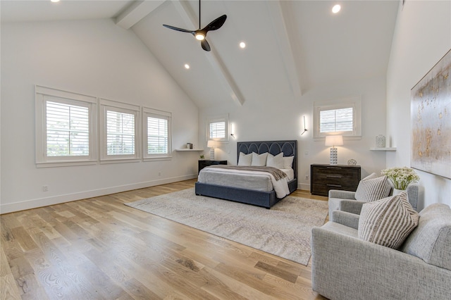 bedroom featuring high vaulted ceiling, multiple windows, beam ceiling, and light wood-style floors