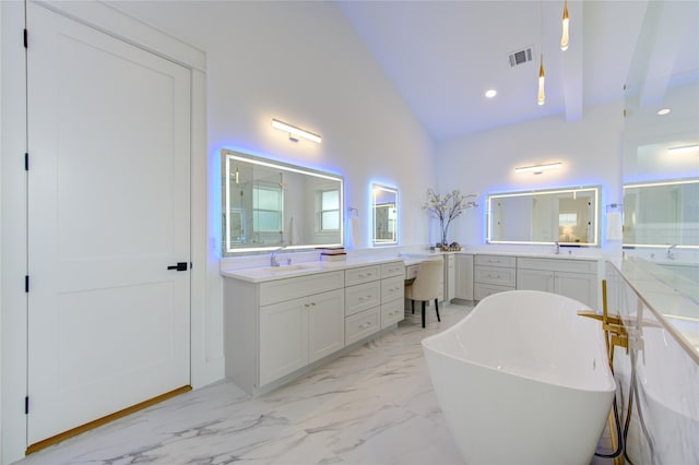 bathroom featuring visible vents, a soaking tub, marble finish floor, vanity, and recessed lighting