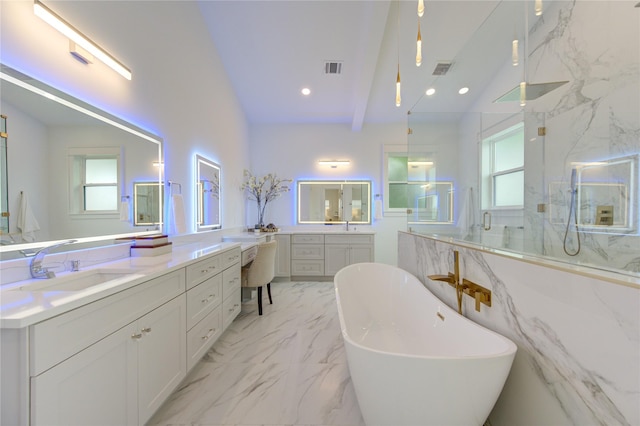 full bath featuring marble finish floor, a marble finish shower, recessed lighting, vanity, and a freestanding tub