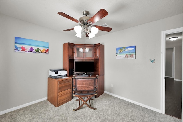 office with a ceiling fan, carpet, visible vents, and baseboards