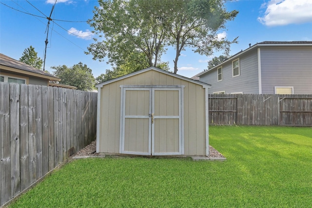 view of shed featuring a fenced backyard