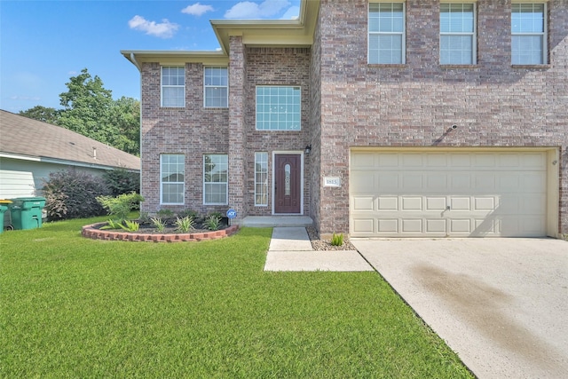 view of front facade with a garage, concrete driveway, brick siding, and a front yard