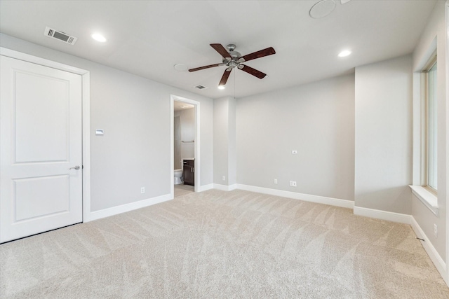 unfurnished room featuring ceiling fan, recessed lighting, light carpet, visible vents, and baseboards