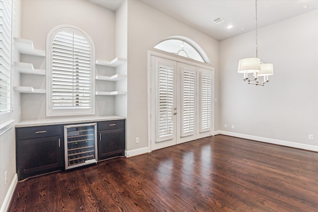 bar with recessed lighting, beverage cooler, dark wood-style flooring, baseboards, and hanging light fixtures