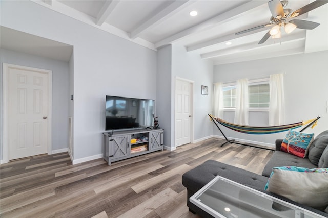 living room featuring beam ceiling, recessed lighting, a ceiling fan, wood finished floors, and baseboards