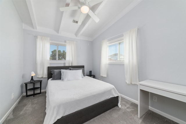 bedroom with dark colored carpet, visible vents, vaulted ceiling with beams, and multiple windows