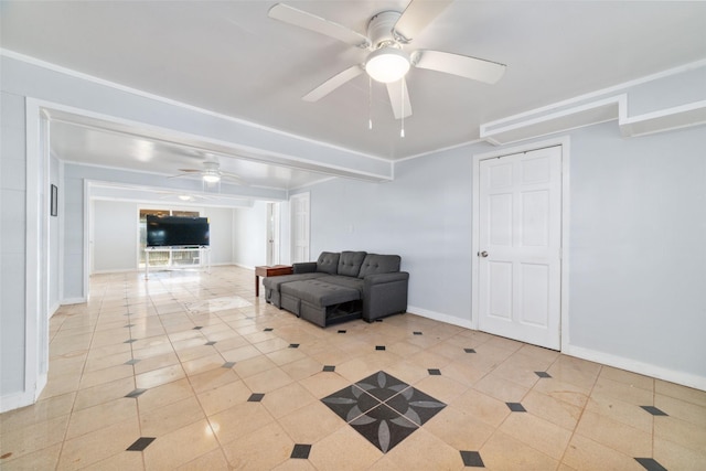 sitting room featuring light tile patterned floors, baseboards, a ceiling fan, and ornamental molding