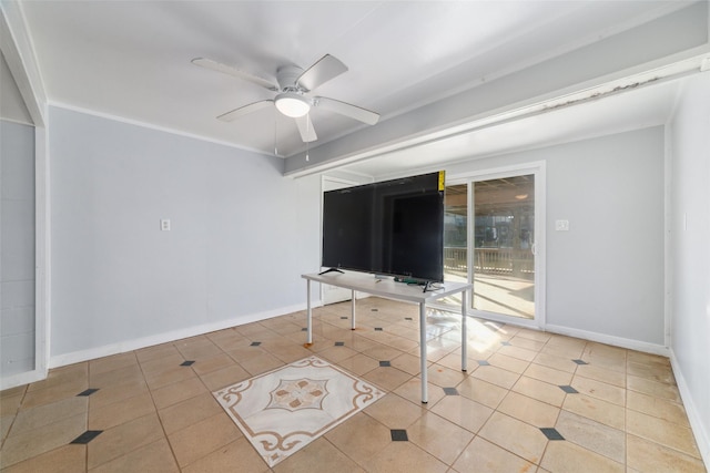 tiled empty room featuring ornamental molding, a ceiling fan, and baseboards