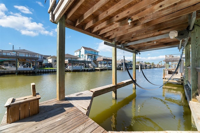 view of dock featuring a water view and boat lift