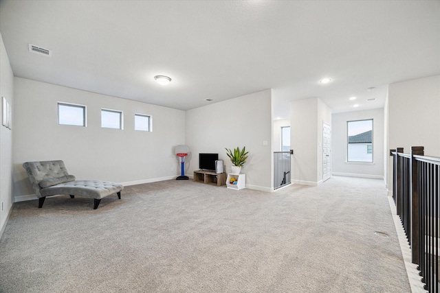 9410 Knollwood Ln, Missouri City, TX 77459 - sitting room featuring light carpet, baseboards, visible vents, an upstairs landing, and recessed lighting