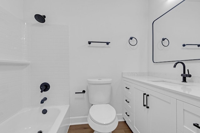 full bathroom with toilet, vanity, shower / tub combination, wood finished floors, and baseboards