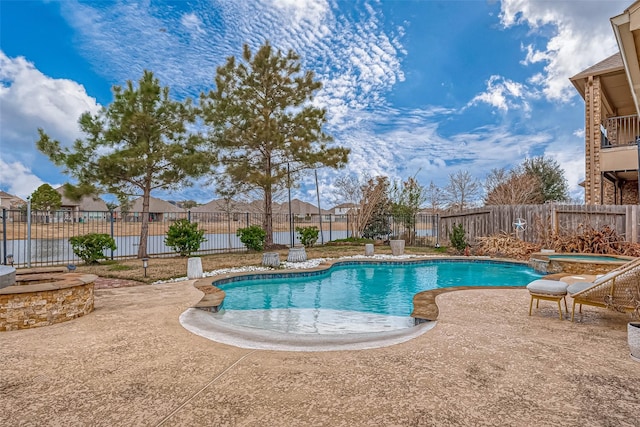 view of swimming pool with a fenced in pool, a patio area, a fenced backyard, and an in ground hot tub