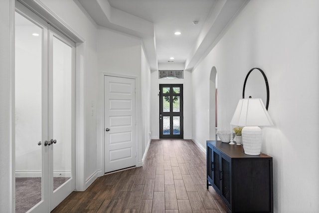 foyer featuring recessed lighting, baseboards, dark wood-style flooring, and french doors