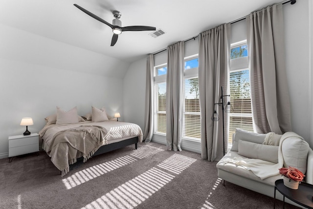 carpeted bedroom with lofted ceiling, access to outside, multiple windows, and visible vents