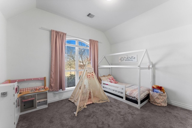 bedroom with vaulted ceiling, dark carpet, visible vents, and baseboards