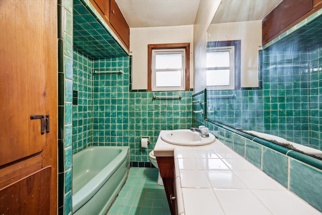 bathroom with tile patterned flooring, toilet, tile walls, and vanity