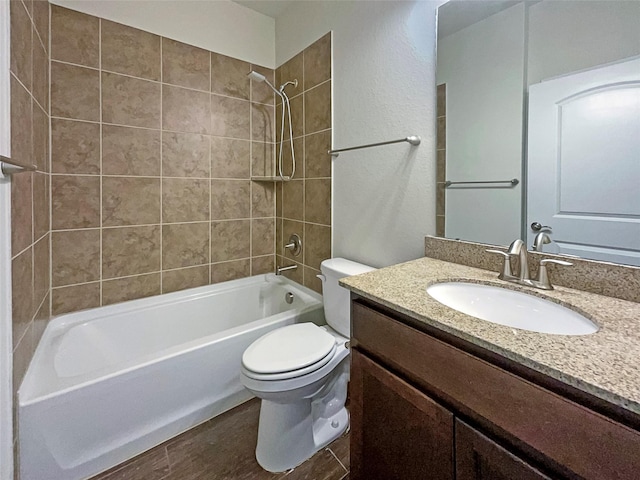 bathroom featuring shower / bathing tub combination, vanity, and toilet