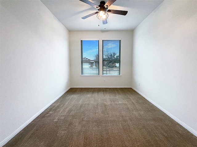 empty room featuring ceiling fan, carpet flooring, and baseboards