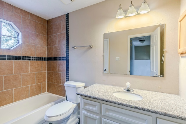 bathroom with shower / washtub combination, vanity, and toilet