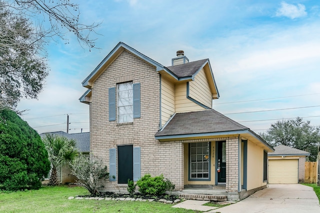 traditional-style home featuring brick siding, a detached garage, a chimney, roof with shingles, and a front lawn