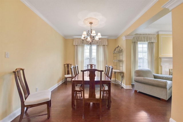 dining room with ornamental molding, a wealth of natural light, dark wood-style flooring, and a notable chandelier