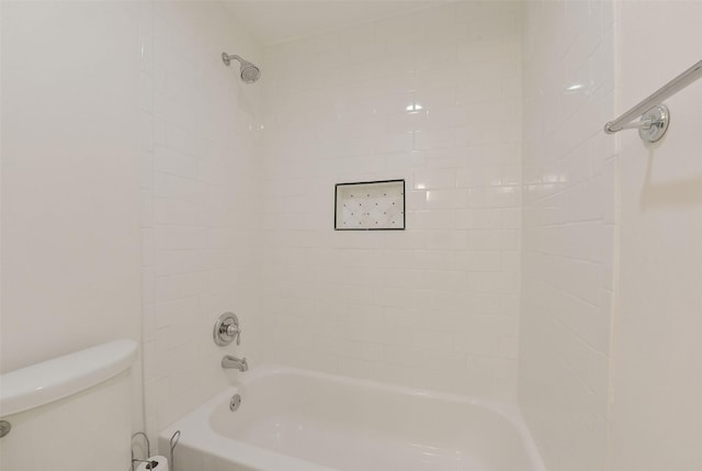 bathroom with shower / washtub combination and toilet