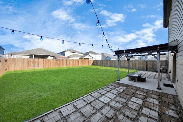 view of yard featuring a fenced backyard, a pergola, and a patio