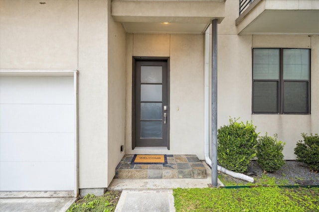 property entrance featuring stucco siding