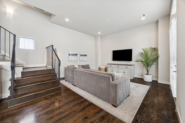 living area featuring recessed lighting, visible vents, stairway, dark wood-type flooring, and baseboards