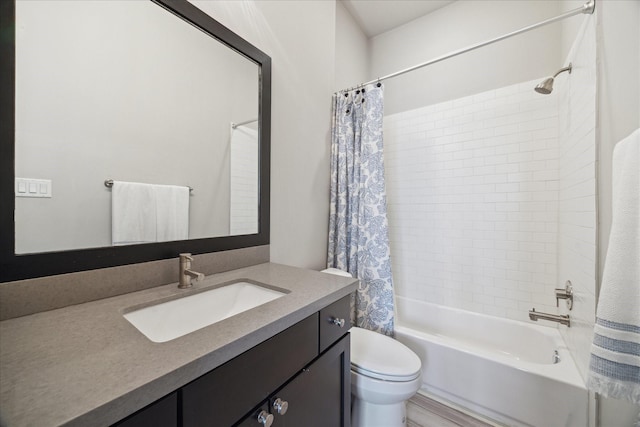 full bath with shower / tub combo, vanity, and toilet