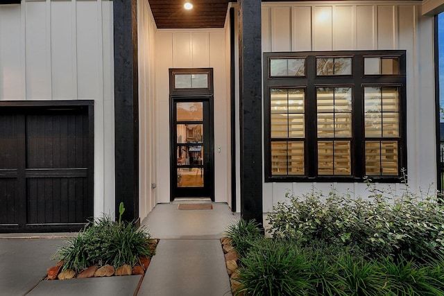 doorway to property featuring board and batten siding