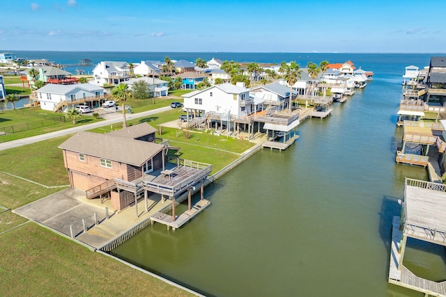 drone / aerial view with a water view and a residential view