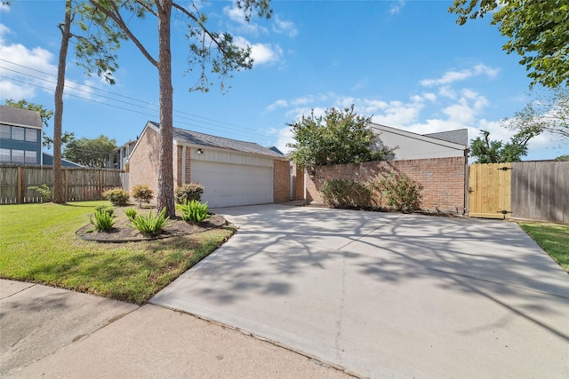 view of front of house with a front yard, a gate, brick siding, and fence