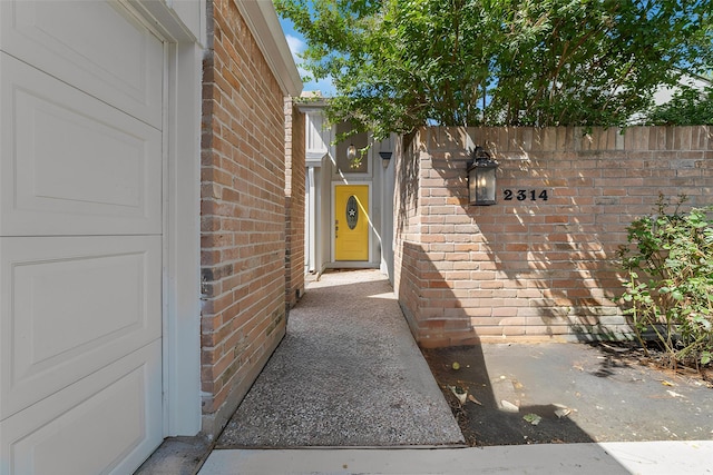 entrance to property with brick siding