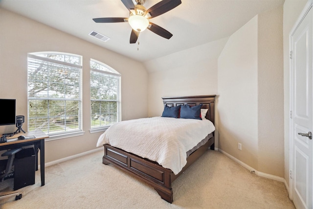 bedroom featuring light carpet, baseboards, visible vents, and vaulted ceiling