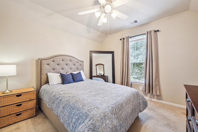 bedroom with vaulted ceiling, baseboards, visible vents, and light colored carpet