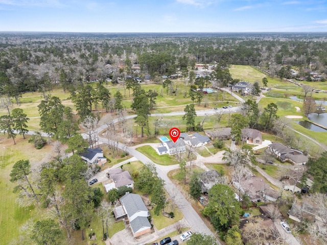 aerial view featuring view of golf course and a residential view