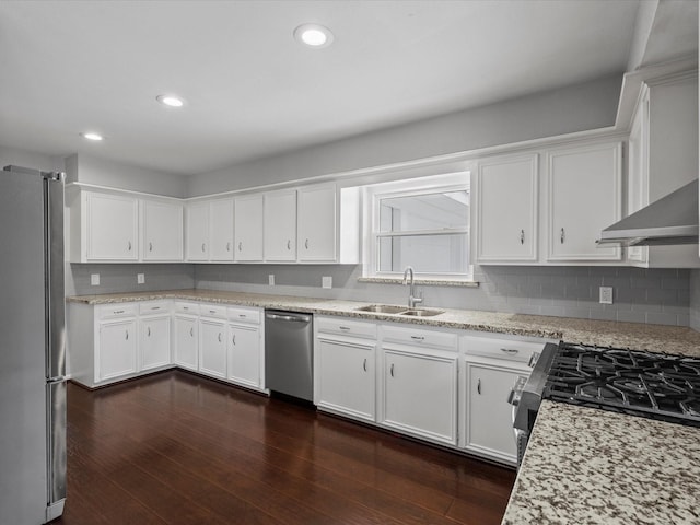 kitchen featuring a sink, white cabinets, and stainless steel appliances