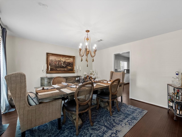 551 Hermitage Ct, Conroe, TX 77302 - dining room with a chandelier and wood finished floors