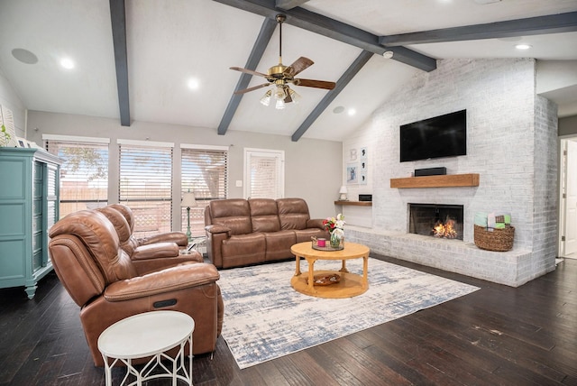 living area with vaulted ceiling with beams, ceiling fan, recessed lighting, dark wood-type flooring, and a fireplace