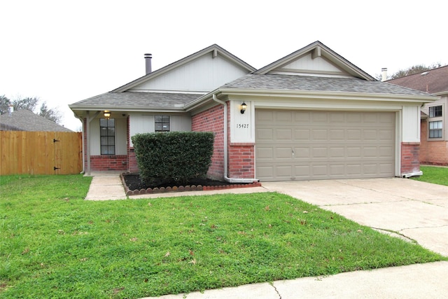 single story home with brick siding, a shingled roof, fence, concrete driveway, and a front lawn