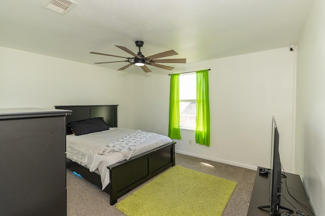 bedroom featuring baseboards, visible vents, and ceiling fan