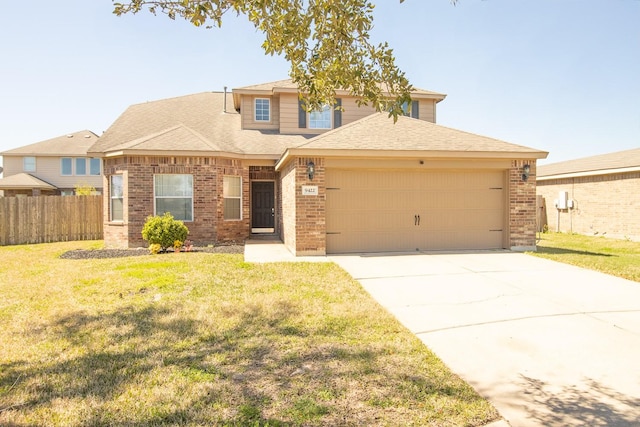 view of front of home featuring a front yard, an attached garage, fence, and brick siding