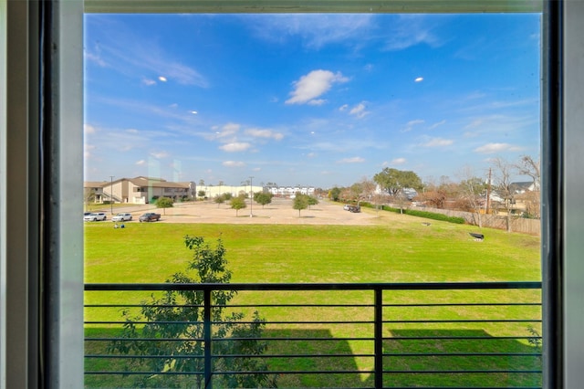 view of yard featuring a balcony